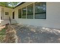 A covered porch provides shade and protection at the main entry to this home at 1987 Darrell Dr, Marietta, GA 30066
