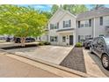 Charming townhome featuring an attractive exterior, front yard, and ample parking space at 261 Venture Path, Hiram, GA 30141