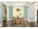 Dining room with hardwood floors and an elegant light fixture at 331 Gordon Ne Ave, Atlanta, GA 30307