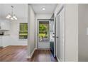 Bright foyer with hardwood floors, coat closet, and view of the front yard at 2035 Mountain Rd, Cumming, GA 30040
