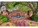 Fairview Park community entrance sign surrounded by colorful flowers and lush greenery at 376 Eagle Tiff Dr, Sugar Hill, GA 30518