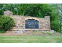 Stone sign for Danbury Park community, surrounded by lush landscaping at 4015 Dodds Grove Ln, Alpharetta, GA 30009