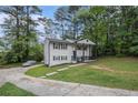 Traditional two-story home showing the side yard and the driveway at 6547 Demere Dr, Morrow, GA 30260