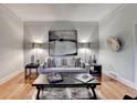 Cozy living room featuring hardwood floors, neutral tones, and elegant decor at 5475 Trowbridge Dr, Dunwoody, GA 30338
