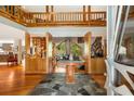 Grand foyer with soaring ceilings, wood accents, spiral staircase, and unique tile flooring creating a striking entrance at 6525 Old Riverside Nw Dr, Sandy Springs, GA 30328