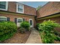 Charming brick home with a well-maintained walkway leading to the front door and beautiful landscaping at 1261 Lavista Rd # N4, Atlanta, GA 30324