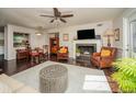 Inviting living room with hardwood floors, a fireplace, stylish furnishings, and a view to the dining area at 1261 Lavista Rd # N4, Atlanta, GA 30324