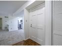 Bright entryway featuring hardwood floors and a modern white door with stylish hardware at 223 Tuxworth Cir, Decatur, GA 30033