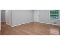 Bright and airy living room featuring hardwood floors, a large window, and neutral paint at 2732 Elkhorn Dr, Decatur, GA 30034