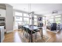Sun-filled living room with large windows, hardwood floors, comfortable seating, and stylish decor at 834 S Columbia Dr, Decatur, GA 30030