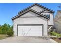 Two story home with attached two car garage and well manicured lawn at 111 Centennial Ridge Dr, Acworth, GA 30102