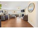 Spacious living room with hardwood floors, cozy fireplace, and ample natural light at 111 Centennial Ridge Dr, Acworth, GA 30102