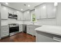 Modern kitchen with stainless steel appliances, sleek countertops, and ample cabinet space at 2801 Holly Oaks Dr, Marietta, GA 30062