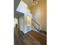 Elegant foyer featuring high ceilings, hardwood floors, and a staircase with white trim and carpet at 310 Bloomfield Ct, Roswell, GA 30075