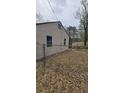View of backyard featuring chain link fence, storage shed, and grassy area at 4064 Sunset Dr, Atlanta, GA 30331