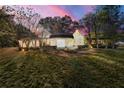 Back view of this lovely home with level yard and outdoor patio area at 2490 Turtle Ter, Grayson, GA 30017