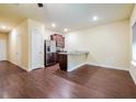 Open-concept kitchen with stainless steel appliances, dark cabinets, and granite countertops at 507 Highwood Ln, Atlanta, GA 30344
