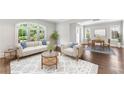 Elegant living area with a view to dining space, neutral decor, and large windows at 893 E Rock Springs Ne Rd, Atlanta, GA 30306
