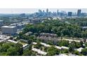 Stunning aerial view of the community, showcasing lush greenery and the downtown skyline at 101 Ardmore Nw Pl # 3, Atlanta, GA 30309