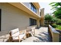 Outdoor patio featuring comfortable seating, manicured landscaping, and a view of the home's exterior at 101 Ardmore Nw Pl # 3, Atlanta, GA 30309