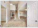 Inviting foyer featuring a staircase, high ceilings, and neutral color palette at 1492 Saint George, Conyers, GA 30012