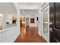 Bright and airy entryway featuring hardwood floors and open access to the living spaces at 1680 Bluestone Dr, Cumming, GA 30041