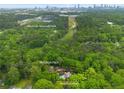 Aerial view showcases the property's location near Westside Reservoir Park and lush greenery at 64 Edwin Pl Nw, Atlanta, GA 30318