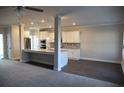 Bright, open-concept living room and kitchen area offers great space for entertaining and relaxation at 505 Brown Dove Ln, Grayson, GA 30017