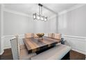 Formal dining room with decorative lighting, seating, and trim at 144 Wetherbrooke Ln # 4, Smyrna, GA 30082