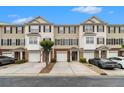 Charming townhouse exterior with attached garages and well-maintained landscaping at 2513 Ivey Crest Cir, Tucker, GA 30084