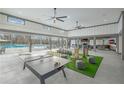 Spacious clubhouse with ping pong, games, and fireplace, offering a variety of activities for residents at 72 Warrior Ct, Braselton, GA 30548