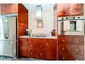 Kitchen detail showcases stainless steel appliances, custom cabinets, and granite countertops at 130 Arizona Ne Ave # 309, Atlanta, GA 30307