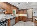 Kitchen with wooden cabinets, stainless steel appliances and plenty of natural light at 130 Floss Flower Ct, Roswell, GA 30076