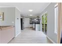 Open-concept kitchen featuring stainless steel appliances, and access to the outdoor deck at 1914 Phillips Lake Blf, Lithonia, GA 30058