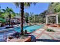 A luxurious backyard oasis showcasing a large swimming pool and a gazebo at 2230 Cammie Wages Rd, Dacula, GA 30019
