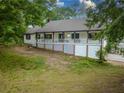 Inviting home with a spacious front porch, offering a charming and welcoming curb appeal at 3241 Briscoe Rd, Loganville, GA 30052