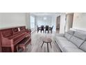 Open-concept living room and dining room with hardwood floors at 2203 Beacon Crest Dr, Buford, GA 30519