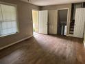 Bright bedroom with neutral paint and flooring and multiple doors for accessibility at 2756 Del Ridge Dr, Douglasville, GA 30135