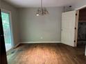 Spacious dining room with sliding doors to the outdoor deck and a view of the backyard at 2756 Del Ridge Dr, Douglasville, GA 30135
