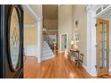 Grand foyer with hardwood floors, a staircase, and an abundance of natural light at 2978 Legislative Ln, Buford, GA 30519