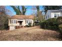 Charming single-Gathering home with a tidy front yard and an unfinished basement garage at 1235 Westboro Sw Dr, Atlanta, GA 30310