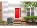 A charming exterior shot shows a red front door with a tidy yard and manicured bushes at 238 Chads Ford Way, Roswell, GA 30076