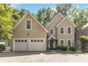 Charming home with a two-car garage, symmetrical windows, and a beautifully landscaped front yard at 2651 Briarlake Rd, Atlanta, GA 30345