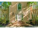 Inviting front entrance with brick steps and decorative planters flanking the doorway at 5105 Jett Forest Trl, Atlanta, GA 30327