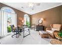 Inviting home office space with ample natural light and a cozy seating area at 1435 Harburn Ct, Cumming, GA 30041