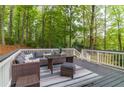 Inviting outdoor deck with stylish furniture, perfect for relaxing and entertaining guests at 607 Hickory Creek Ln, Woodstock, GA 30188