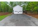 Spacious detached two-car garage with ample parking space and a private entrance at 607 Hickory Creek Ln, Woodstock, GA 30188
