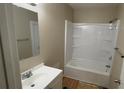 Cozy bathroom featuring a vanity, mirror, and a shower-tub combination at 2888 Mountain View Rd, Snellville, GA 30078