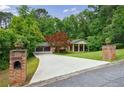 Beautifully landscaped property with mature trees and long private driveway at 4311 N Elizabeth Se Ln, Atlanta, GA 30339