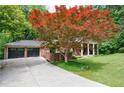 Lovely home with a well maintained lawn and oversized two car garage at 4311 N Elizabeth Se Ln, Atlanta, GA 30339